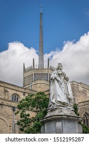 A View Of Blackburn Cathedral With Statue Of Queen Victoria.