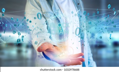 View of a Blockchain title with 0 and 1 data flying over - Shutterstock ID 1032978688