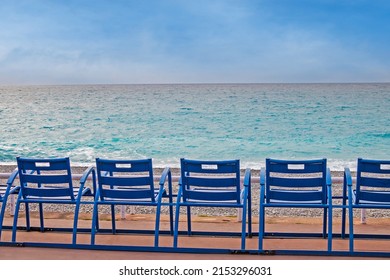 view of blue chairs in front of the sea - Shutterstock ID 2153296031