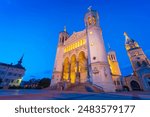 View at the blue hour of the illuminated facade of the Basilica de Fourvière in Lyon, France