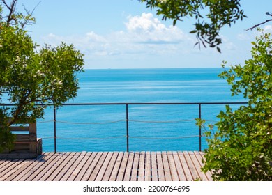 View Of The Blue Sea From The Wooden Veranda