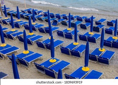 View Of Blue Sun Beds And Umbrellas On A Monterosso Al Mare Beach, Cinque Terre