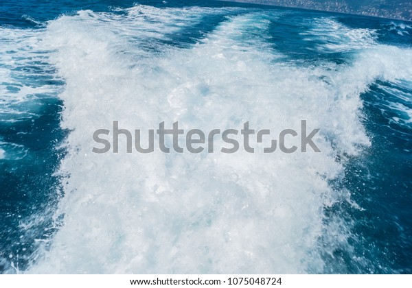 View\
from board of cutter with blue water and sea\
foam