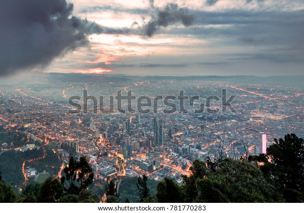 View of\
Bogota on a cloudy sunset from\
Monserrate