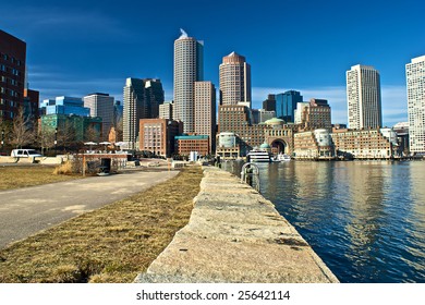 view of boston from harbor and rowes wharf and skyscraper buildings in boston massachusetts