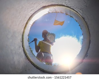 view of bottom low angle of the golf hole, a golf ball in hand of golf player being takes away from the hole on the green by woman golf player after putted successfully a winner 