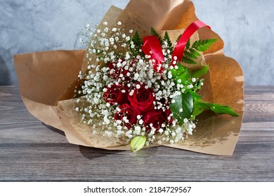 A View Of A Bouquet Of A Dozen Red Roses.