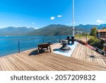 View from the bow upper deck of a steamship paddle wheel steamer on Kootenay Lake in the rural village of Kaslo, BC, Canada at summer.