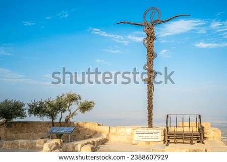 View at the The Brazen Serpent sculpture and view towards the Promised Land–Dead Sea and Jerusalem ,Mont Nebo, Jordan