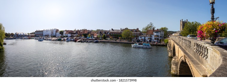 View from the bridge over the River Thames at Henley in Oxfordshire, England. Wide panoramic landscape - Shutterstock ID 1821573998