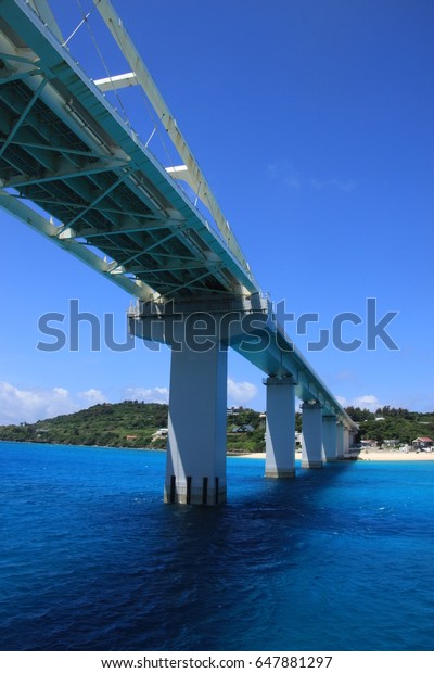 The view of the bridge to Sesoko island\
from Okinawa island , seeing from a\
ferry.
