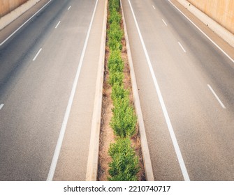 View From The Brige On A Two Way Highway With Bushes On A Dividing Line