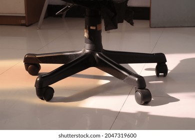 View Of Broken Office Chair Wheels.