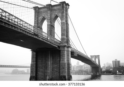 View Brooklyn Bridge With Foggy City In The Background