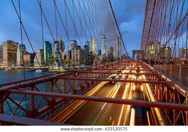 View of Brooklyn Bridge at night with car traffic\
Brooklyn Bridge at night