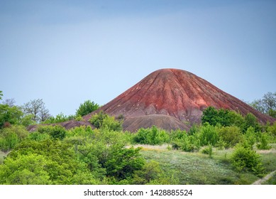 View Of Brown Spoil Tip In Green Steppe