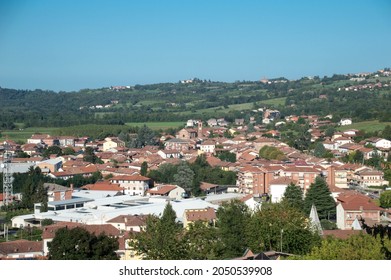 A View Of Brusasco, A Village Near The Town Of Turin, In Piedmont, Italy. The Parish Church, Dedicated To Saint Peter, Is Visible Amist The Houses
