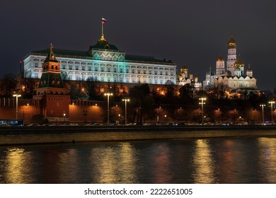 View of the building of the Grand Kremlin Palace, the Annunciation Tower and the ensemble of the Kremlin Cathedral Square from the embankment of the Moskva River with night lighting, Moscow, Russia - Shutterstock ID 2222651005