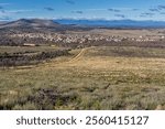 View of the burnt mountain after a forest fire and the town of Ferreras de Abajo from the Mirador de La Pedrizona area, Sierra de la Culebra, Zamora, Castilla y León, Spain.