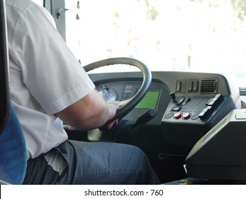 View Of Bus Driver With Hands On Steering Wheel