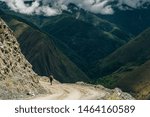 View bus gravel road to mountains Machu Picchu, Peru