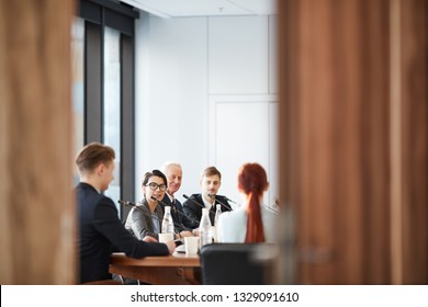 View Of Business Meeting In Conference Room Through Open Door, Copy Space