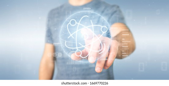 View of a Businessman holding an atom icon surrounded by data