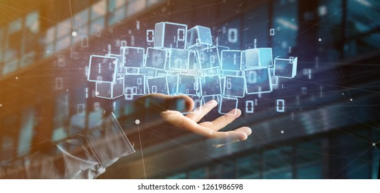 View of a Businessman holding a Cloud of blockchain cube and binary data 3d rendering