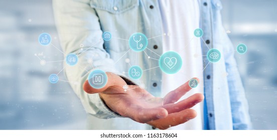 View of a Businessman holding Medical icon and connection 3d rendering - Shutterstock ID 1163178604