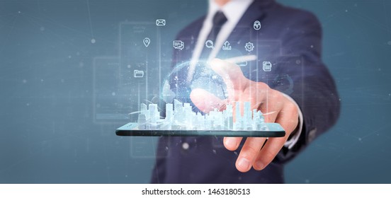 View of Businessman holding Smart city user interface with icon, stats and data 3d rendering - Shutterstock ID 1463180513