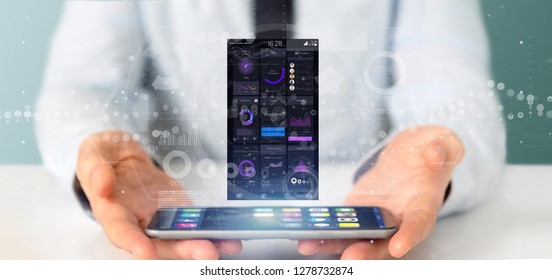 View of Businessman holding Smartphone with user interface data on the screen isolated on a background - Shutterstock ID 1278732874