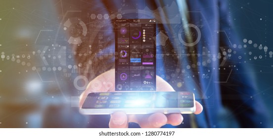 View of Businessman holding Smartphone with user interface data on the screen isolated on a background - Shutterstock ID 1280774197