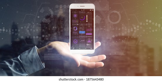 View of Businessman holding Smartphone with user interface data on the screen isolated on a background - Shutterstock ID 1875643480