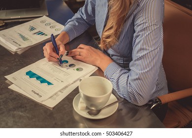 View of businesswoman hands , she sitting at the table and write on papper - Shutterstock ID 503406427