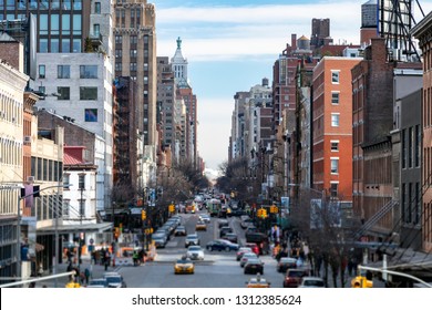 View Of A Busy 14th Street In The Chelsea Neighborhood With People And Traffic In New York City NYC