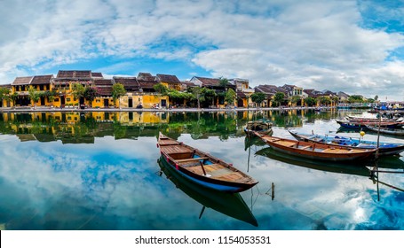 view of busy river in Hoi An, Vietnam. Hoi An is the World's Cultural heritage site, famous for mixed cultures and architecture.                               - Powered by Shutterstock