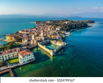 View by Drone - Castle Rocca Scaligera in Sirmione, Garda Lake. spectacular view on lake, italian summer view aerial by Drone