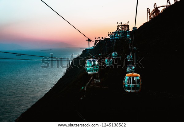 View of a cable car at\
sunset