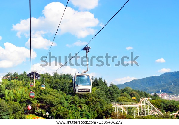 View of cable car transportation system for\
tourist traveling up and down to the mountain in summer or spring\
season ,this place is one of the famous tourist destination in\
Daegu, South Korea.