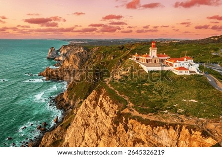 View of the Cabo da Roca Lighthouse at sunset. Sintra, Portugal. Portuguese Farol de Cabo da Roca is a cape which forms the westernmost point Eurasian land mass. The most western point of Europe.