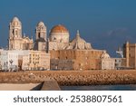 View of Cadiz Cathedral and Coastal Cityscape at Sunset