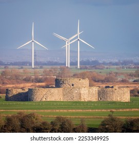 View of Camber Castle and little Cheyne windfarm from the Strand gate Winchelsea high weald east Sussex south east England - Shutterstock ID 2253349925