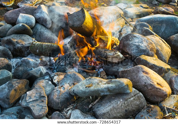 View Camping Fire Stone Fire Pit Stock Photo Edit Now 728654317