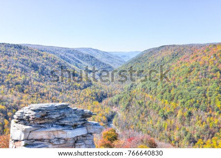 View of canaan valley mountains in Blackwater falls state park in West Virginia during colorful autumn fall season with yellow foliage on trees, rock cliff at Lindy Point