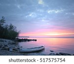 View of a Canoe and pink sunset, Hecla Island, Provincial Park