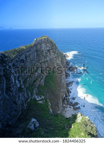 Similar – Image, Stock Photo Green rocky coast at a calm sea in northern Spain