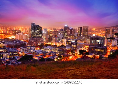 View Of Cape Town City At Dusk With Beautiful Sunset, Twilight Sky And Illuminating Night Streets At Night