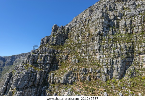 View from Cape Town\'s Table Mountain cable car as\
it take tourists up to the top and back from the base of the\
mountain. Table Mountain is one of the seven wonders of the world\
located in South Africa