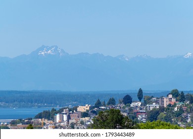 View from Capitol Hill in Seattle of the Olympic Mountains in West Washington, Puget Sound, and Queen Anne Hill in Seattle on a summer day in July.