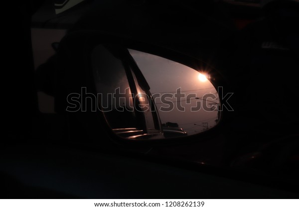 A view captured\
from a car review mirror